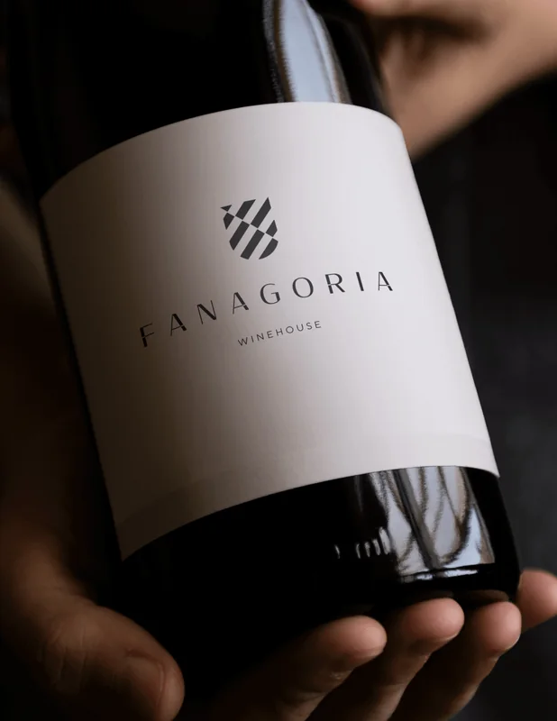 A Fanagoria bottle with the new label held in the hand